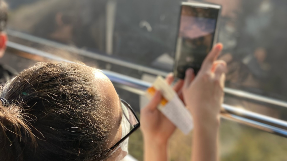 Taking a picture out the side of a Korean cable car