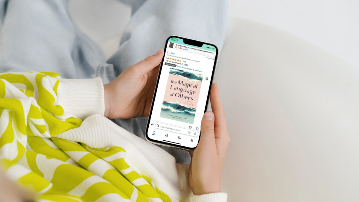 A person looking at the Magical Language of Others on their smart phone.